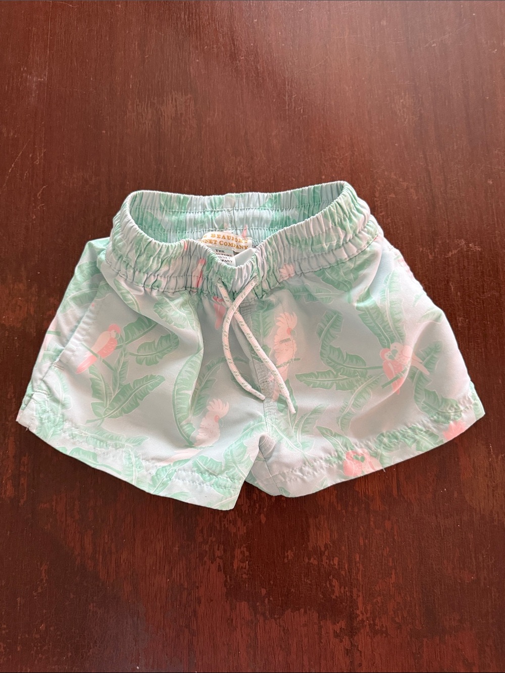 The Beaufort Bonnet Company Mint Green Swim Trunks with Pink Tropical Print